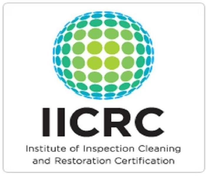 image of iicrc logo with a blue and green ball behind the text
