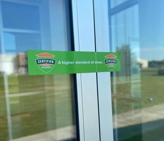 glass door with Certified: SERVPRO Cleaned logo