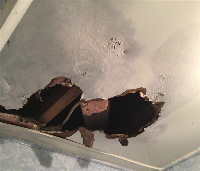 roof damage and ceiling collapse