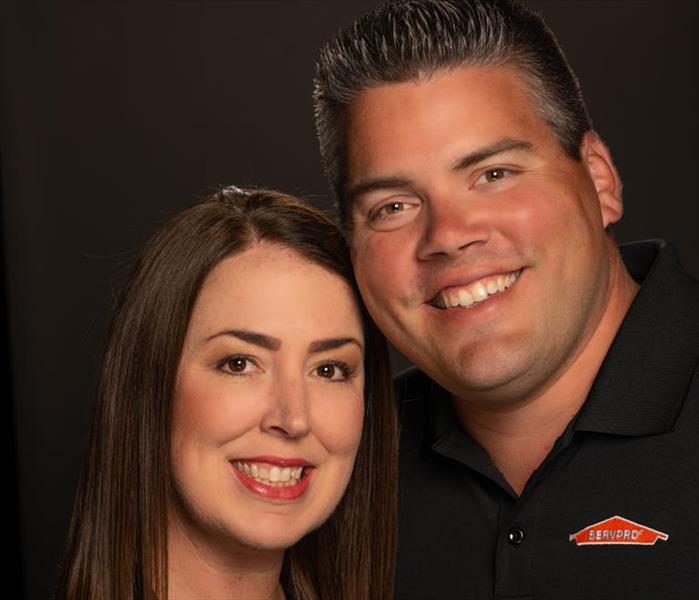 photo of a man and woman in a black shirt with a SERVPRO logo